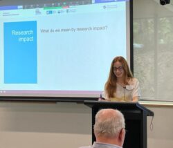 Photograph of Dr Cristina G. Stefan presenting at the Institute for Social Science Research at the University of Queensland.